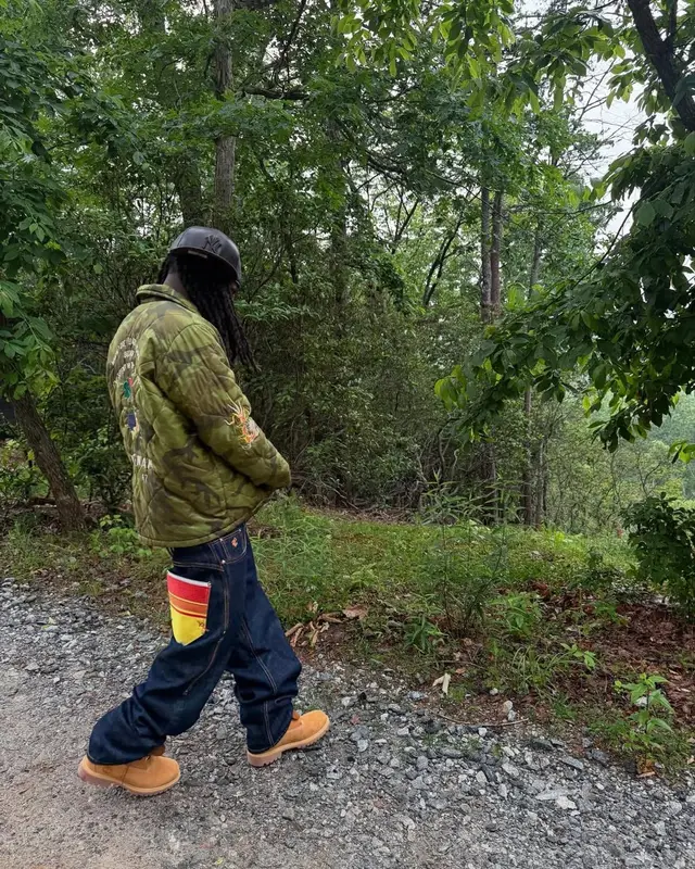 Kai Cenat outfit in Vintage, Louis Vuitton, and New Era, 2025