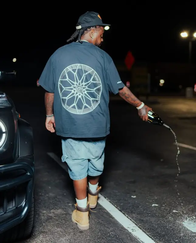 Babyface Ray outfit in Balenciaga, Louis Vuitton, and Lamborghini, 2025