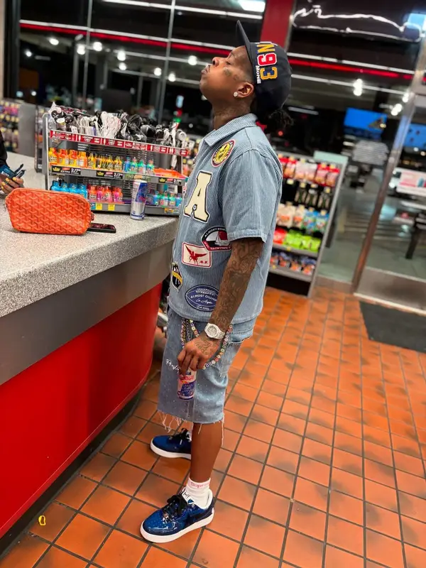 Finesse2tymes outfit in Bape, Supreme, and Hanes, 2025