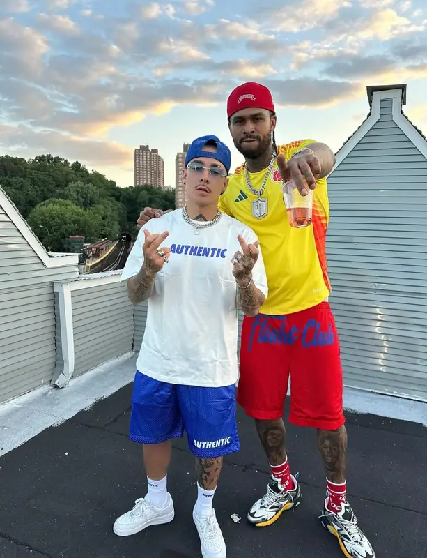 Dave East outfit in Adidas, Champion, and Louis Vuitton, 2025