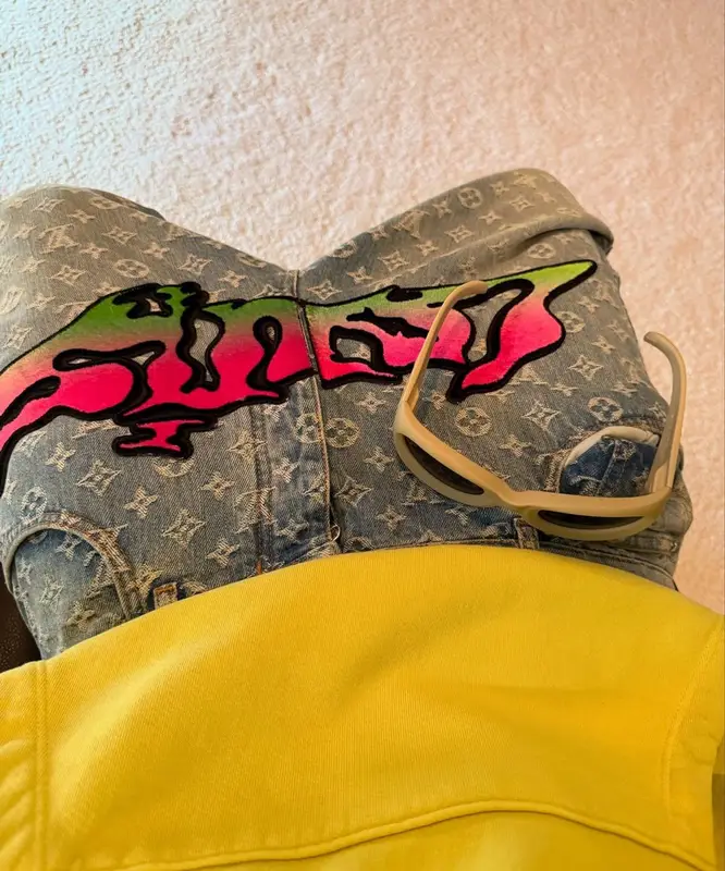 Kai Cenat outfit in Louis Vuitton, Rimowa, and Skylrk, 2025