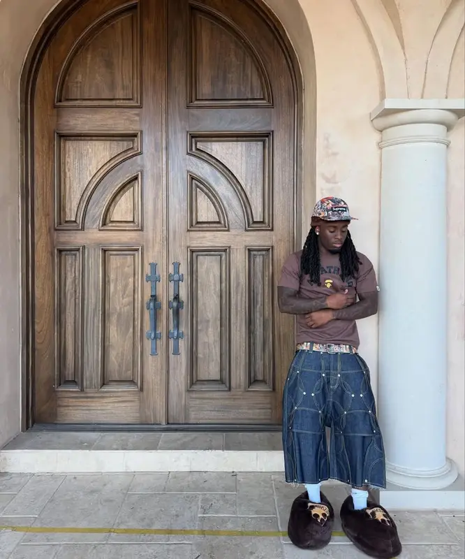 Kai Cenat outfit in Bape, Supreme, and Bored Ape Yacht Club Merch, 2025