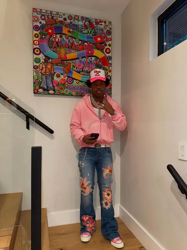 Lil Baby outfit in Converse, Chrome Hearts, and Wooooo! Energy Drink Merch, 2025