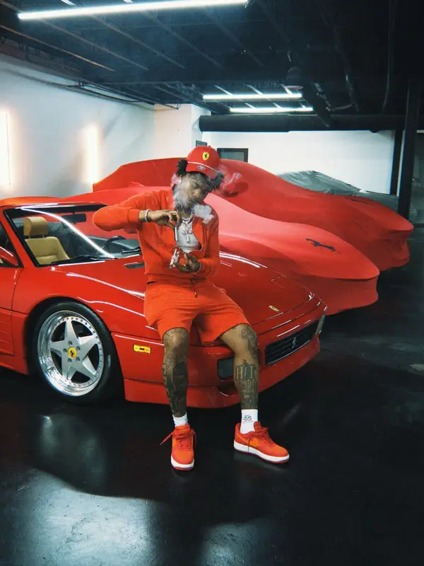Lil Baby outfit in Louis Vuitton, Puma, and Ferrari, 2026