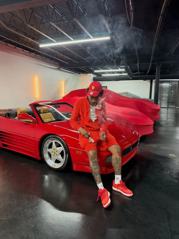 Lil Baby outfit in Louis Vuitton, Puma, and Ferrari, 2026