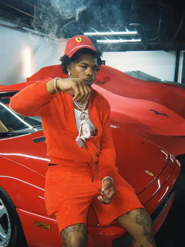 Lil Baby outfit in Louis Vuitton, Puma, and Ferrari, 2026