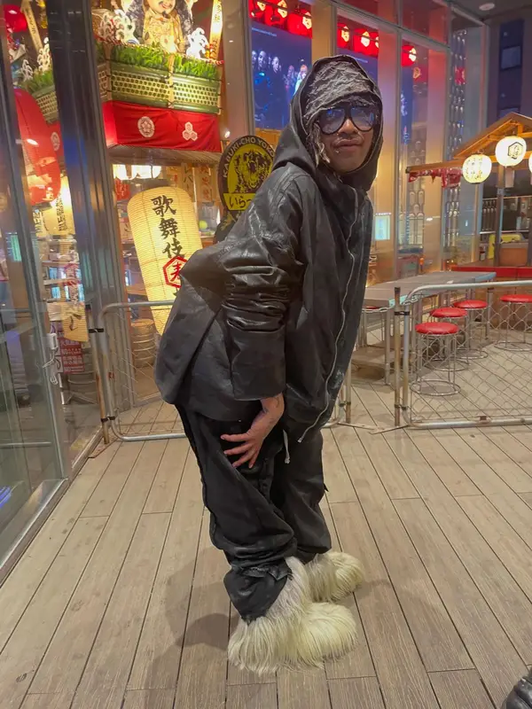 Lil Tracy outfit in Rick Owens, Moncler, and Tom Ford, 2026