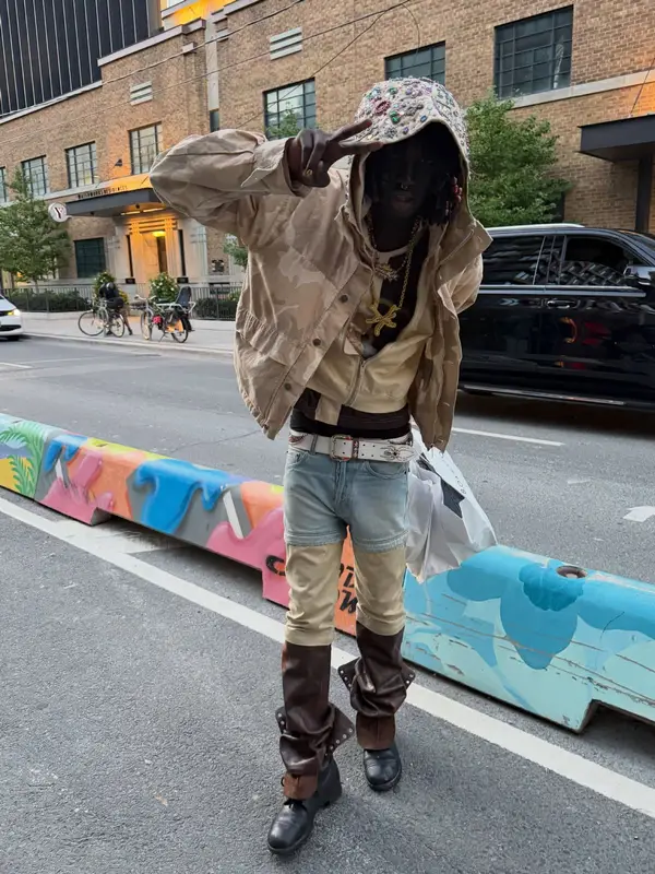 Pz' outfit in Sicko, Mannahatta NYC, and Satoshi Nakamoto, 2026