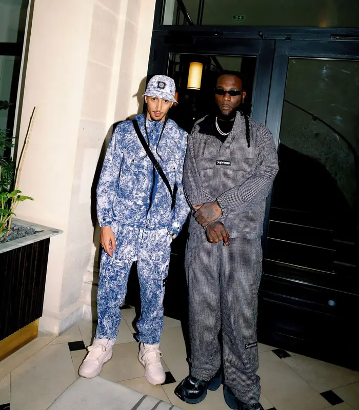 Burna Boy outfit in Supreme, Balenciaga, and Chrome Hearts, 2026