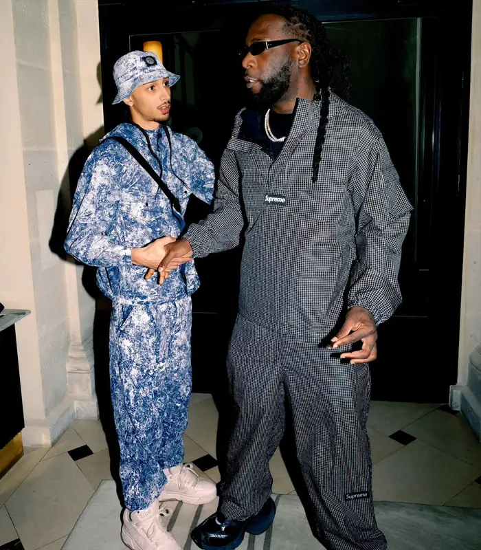 Burna Boy outfit in Supreme, Balenciaga, and Chrome Hearts, 2026