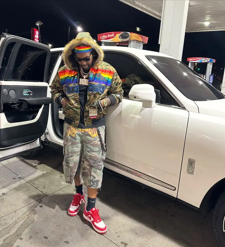 Peezy outfit in Supreme, Versace, and Mitchell & Ness, 2026