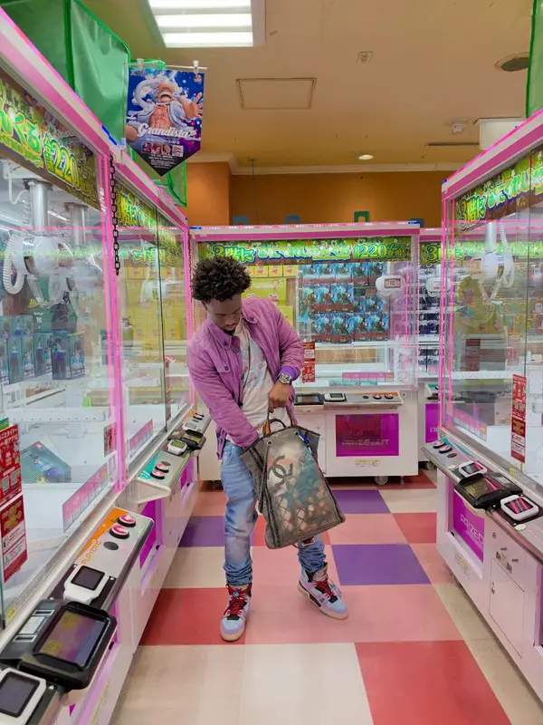 Kai Cenat outfit in Dolce & Gabbana, Louis Vuitton, and Balenciaga, 2026