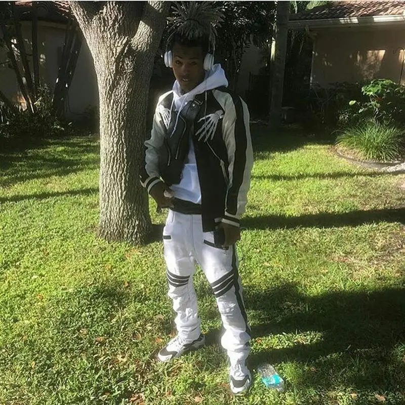 XXXTentacion outfit in No Name, Louis Vuitton, and Nike, 2018