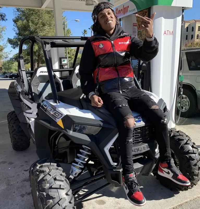Rich The Kid outfit in Louis Vuitton, Moncler, and Palm Angels, 2019