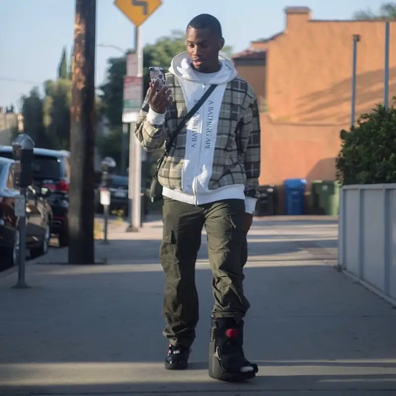 Denzel Curry outfit in Bape, Carhartt, and Palace, 2019