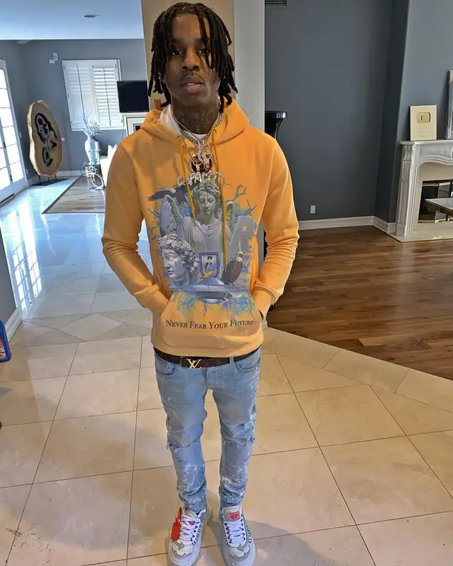 Polo G outfit in Ricchezza Forever, Amiri, and Louis Vuitton, 2019
