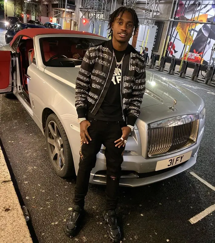 Lil Tjay outfit in Amiri, Givenchy, and Prada, 2019