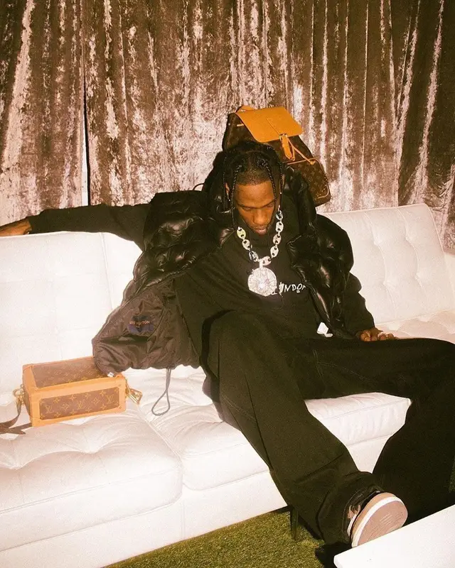Travis Scott outfit in Travis Scott Merch, Louis Vuitton, and Nike, 2019