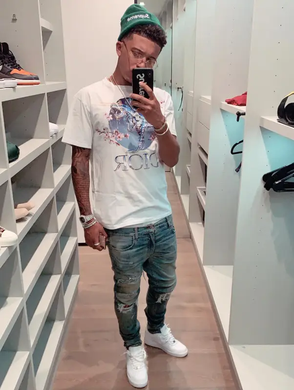Jadon Sancho outfit in Dior, New Era, and Supreme, 2020
