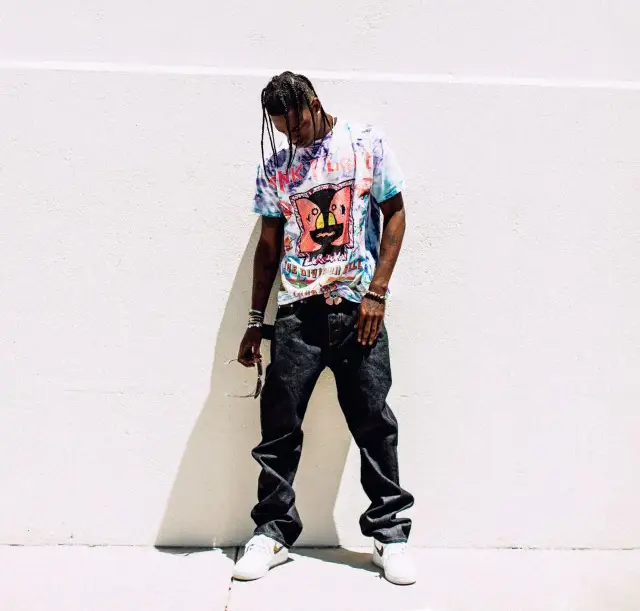 Travis Scott outfit in Pink Floyd Merch, McDonald's Merch, and Vivienne Westwood, 2020