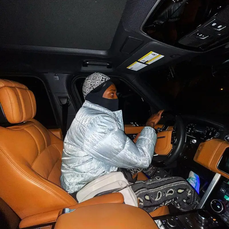 Meek Mill outfit in Dior, Amiri, and Louis Vuitton, 2020