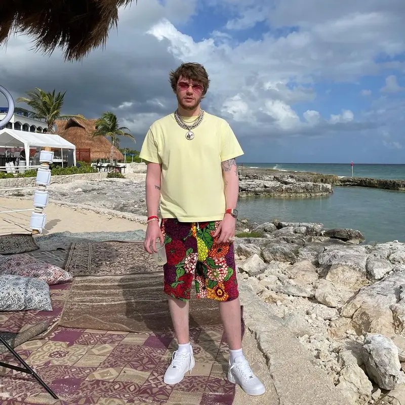 Murda Beatz outfit in Louis Vuitton, Gucci, and Nike, 2020