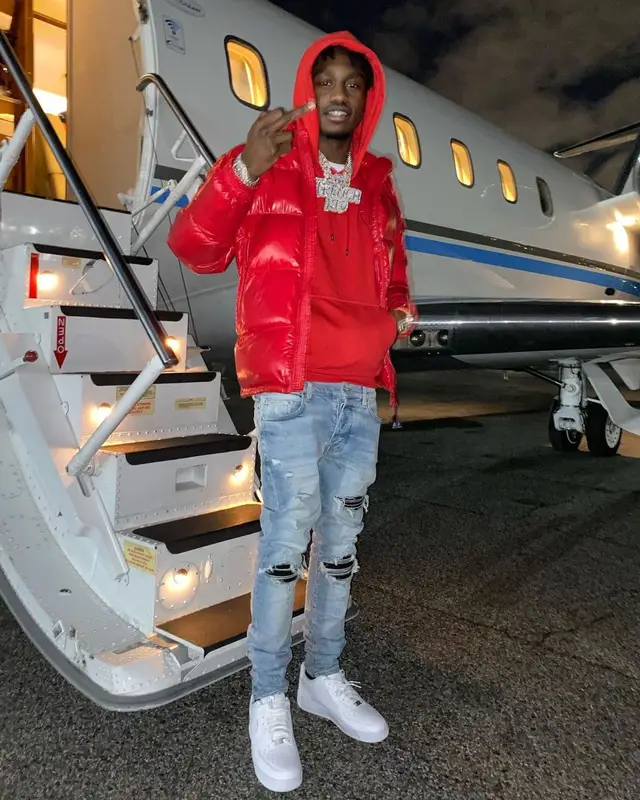 Lil Tjay outfit in Moncler, Dior, and Amiri, 2021