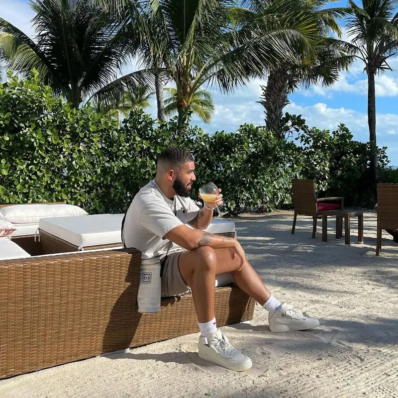 Drake outfit in Chanel, Nike, and Drake Merch, 2021