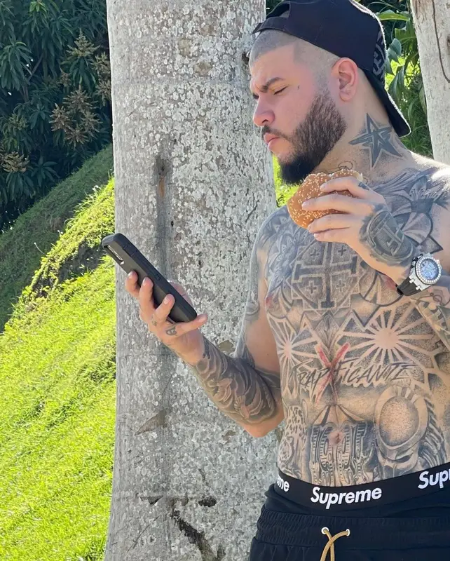 Farruko outfit in Jordan, Fendi, and Supreme, 2021