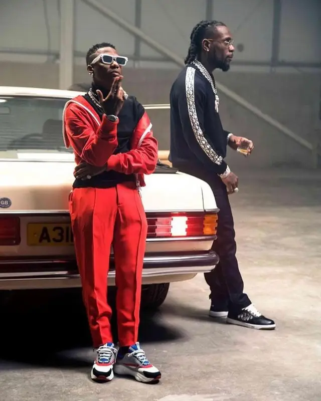 Wizkid outfit in Versace, Marc Jacques Burton, and Louis Vuitton, 2021
