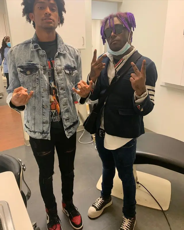 Lil Uzi Vert outfit in Thom Browne, Marni, and Louis Vuitton, 2021