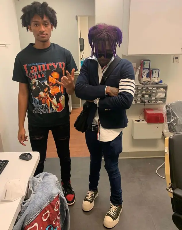 Lil Uzi Vert outfit in Thom Browne, Marni, and Louis Vuitton, 2021