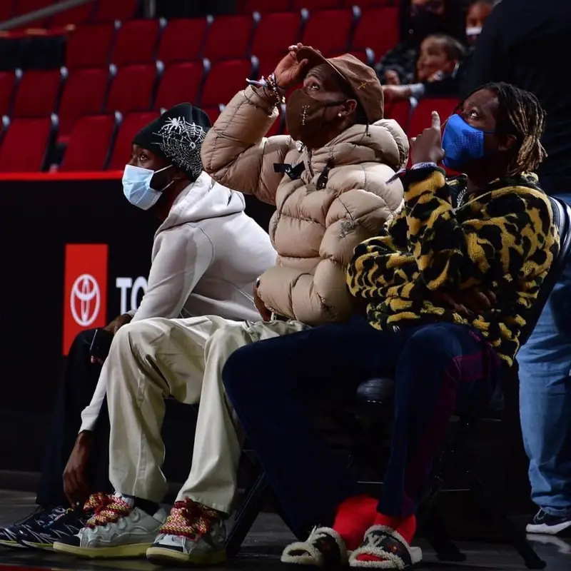 Don Toliver outfit in Bape, Needles, and Louis Vuitton, 2021
