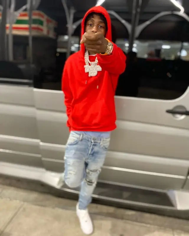 Lil Tjay outfit in Dior, Amiri, and Nike, 2021