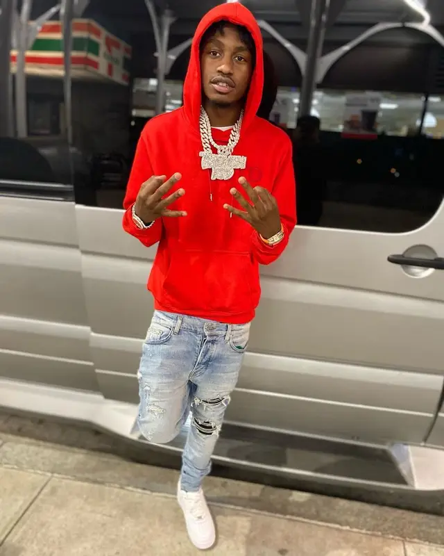 Lil Tjay outfit in Dior, Amiri, and Nike, 2021