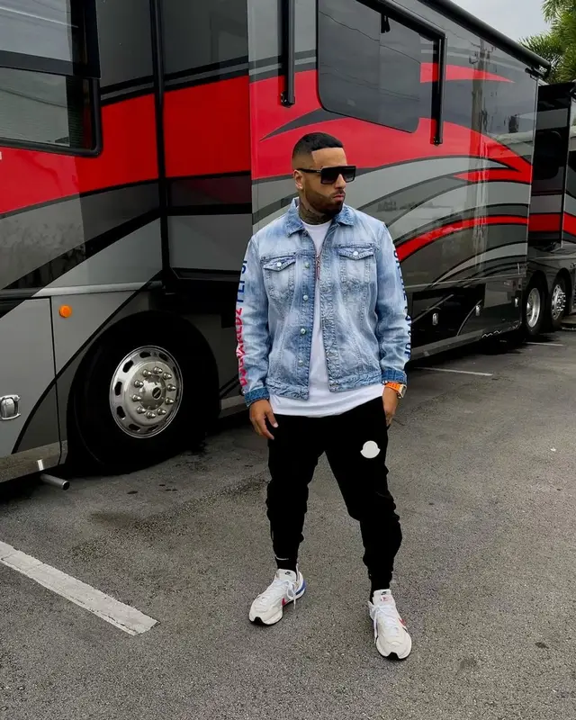 Nicky Jam outfit in Dsquared2, Moncler, and Nike, 2021