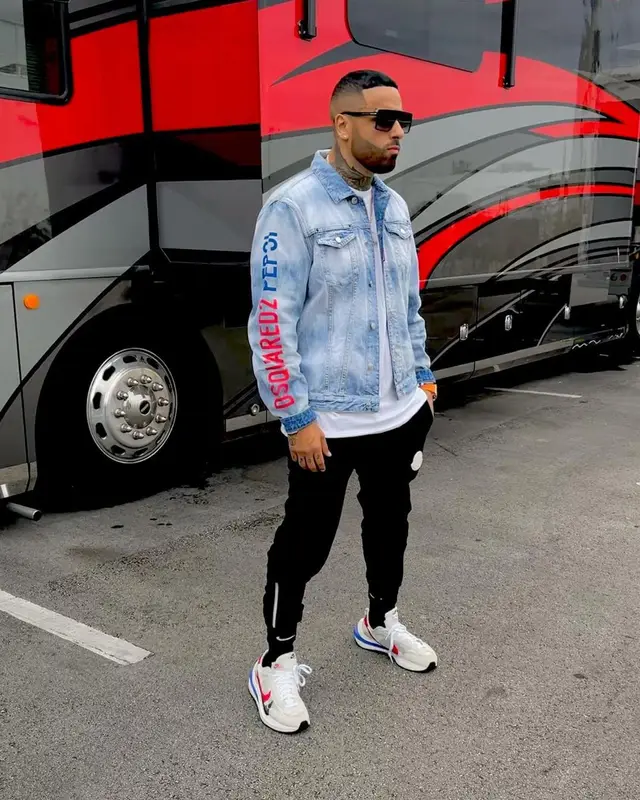 Nicky Jam outfit in Dsquared2, Moncler, and Nike, 2021