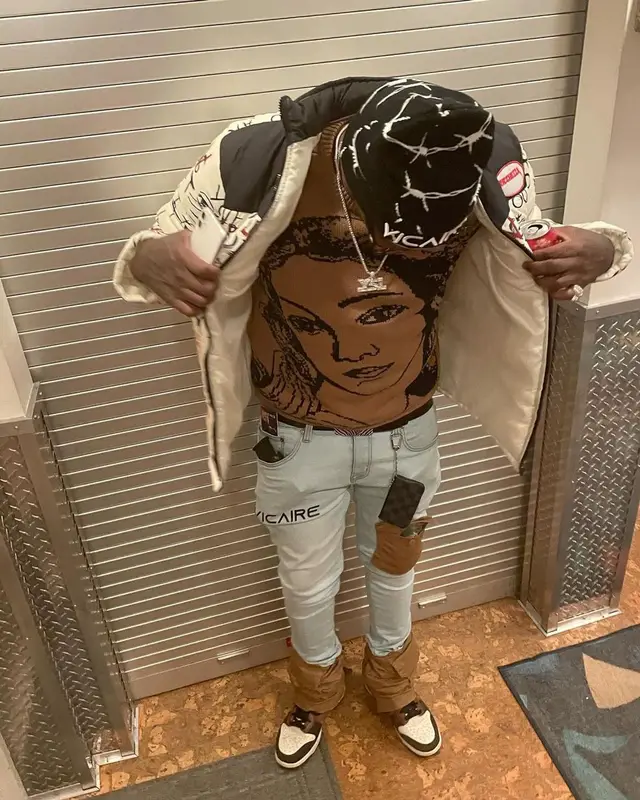 Lil Duke outfit in Ricchezza Forever, Vicaire, and Louis Vuitton, 2021