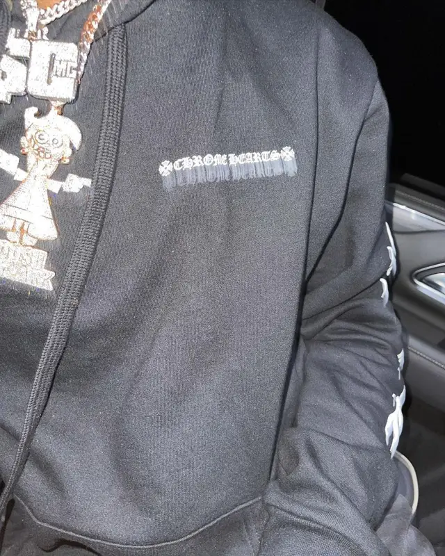 Toosii outfit in Amiri, Nike, and New Era, 2021