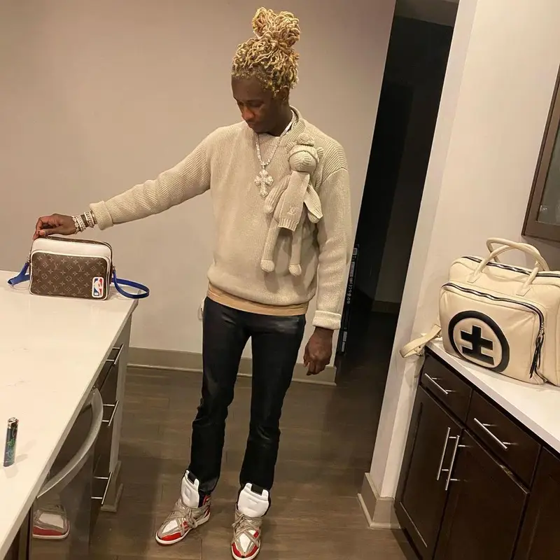 Young Thug outfit in Louis Vuitton, NBA, and Cease±Desist, 2021