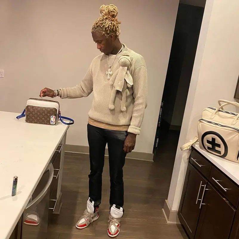 Young Thug outfit in Louis Vuitton, NBA, and Cease±Desist, 2021
