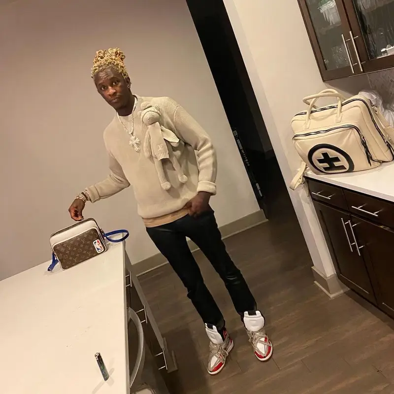 Young Thug outfit in Louis Vuitton, NBA, and Cease±Desist, 2021