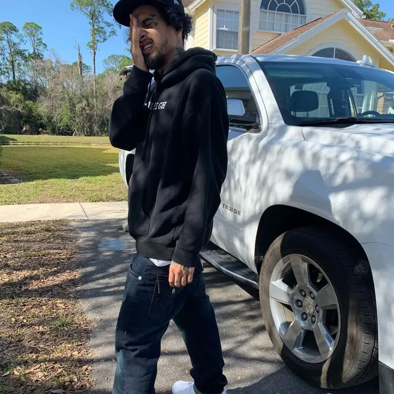 Wifisfuneral outfit in Rihanna Merch, True Religion, and New Era, 2021