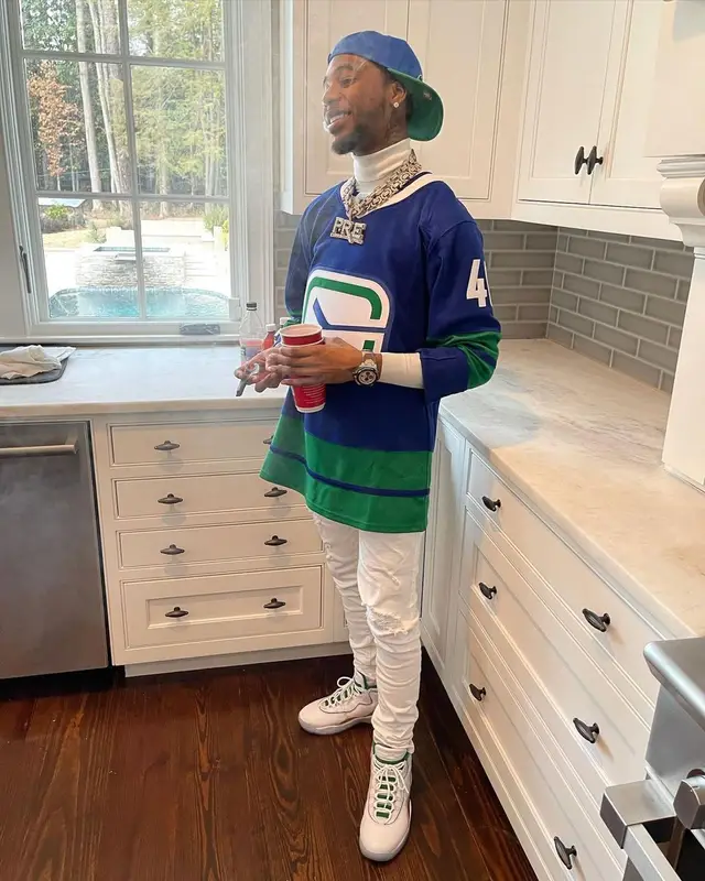 Key Glock outfit in Amiri, Jordan, and Mitchell & Ness, 2021
