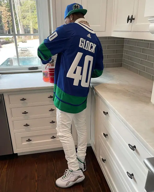 Key Glock outfit in Amiri, Jordan, and Mitchell & Ness, 2021