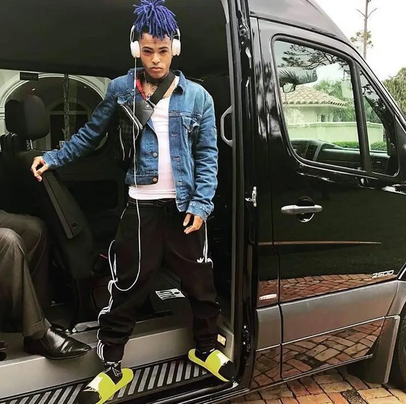 XXXTentacion outfit in Gucci, Adidas, and Louis Vuitton, 2018