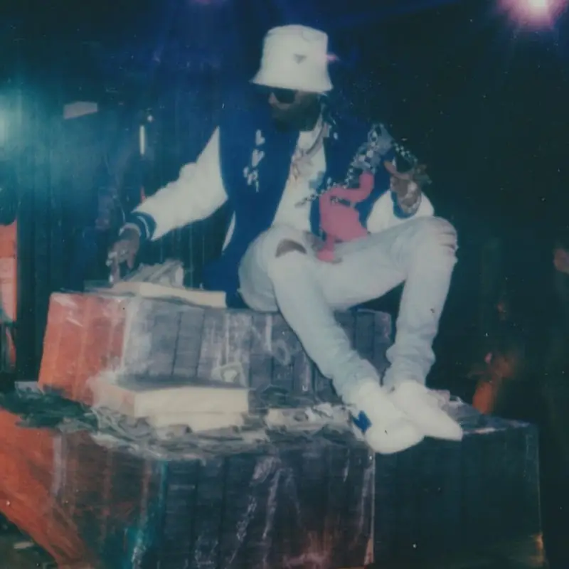 Tory Lanez outfit in Louis Vuitton, Amiri, and Prada, 2021