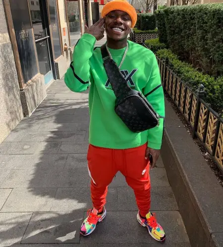 DaBaby outfit in Armani Exchange, Nike, and Louis Vuitton, 2020