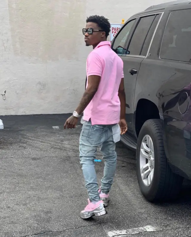 Roddy Ricch outfit in Polo Ralph Lauren, Purple Brand, and Chanel, 2020