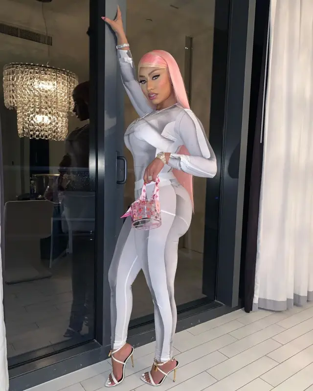 Nicki Minaj outfit in TTSWRTS, Louis Vuitton, and Tom Ford, 2020